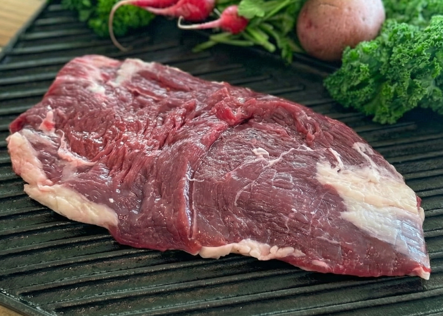 Beef Flank Steak on a black plan