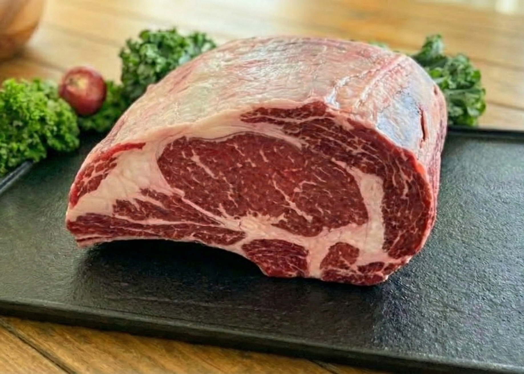 Beef Standing Rib Roast (5 Bone) on a black pan