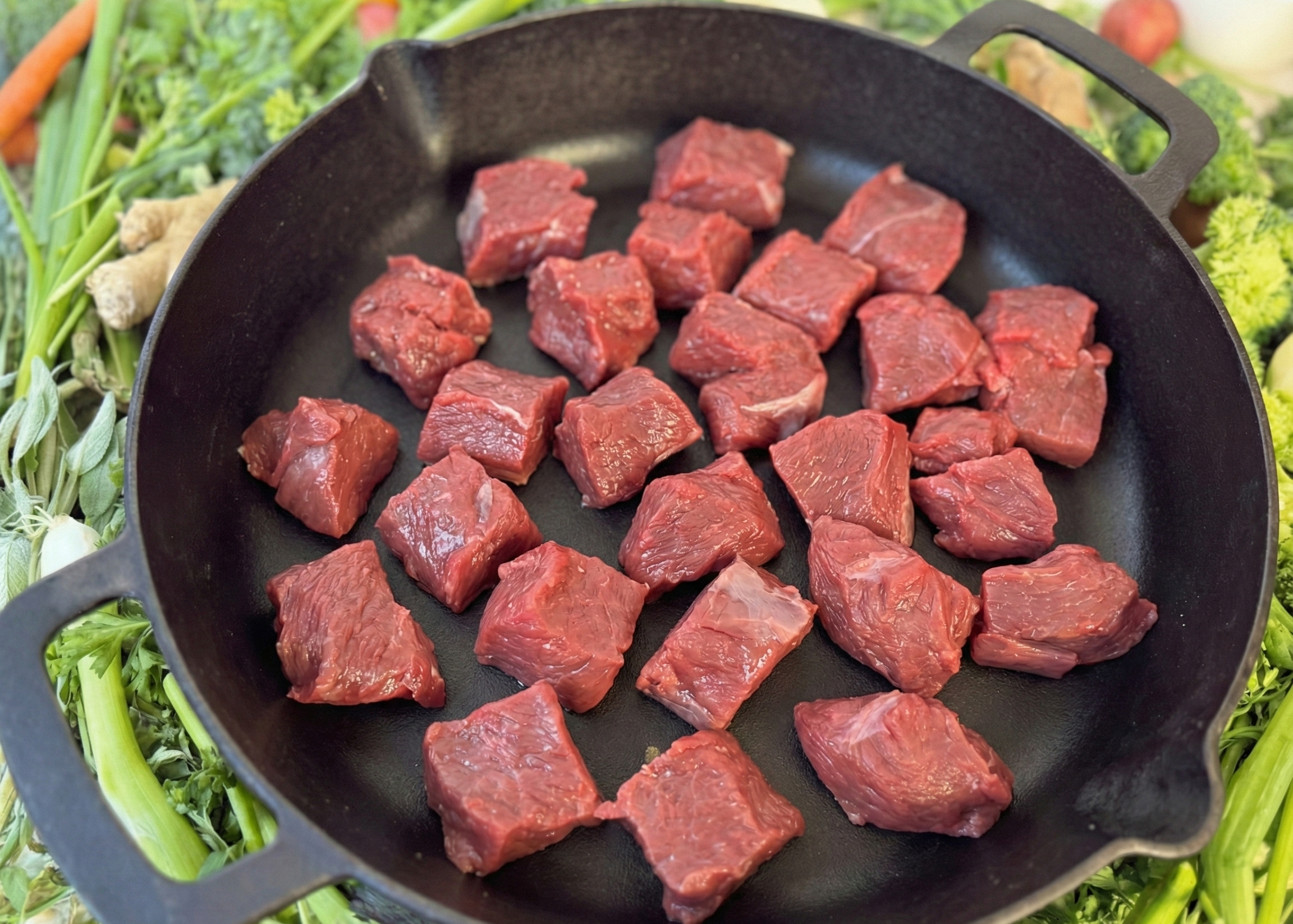 Buffalo Stew Meat in a black pan
