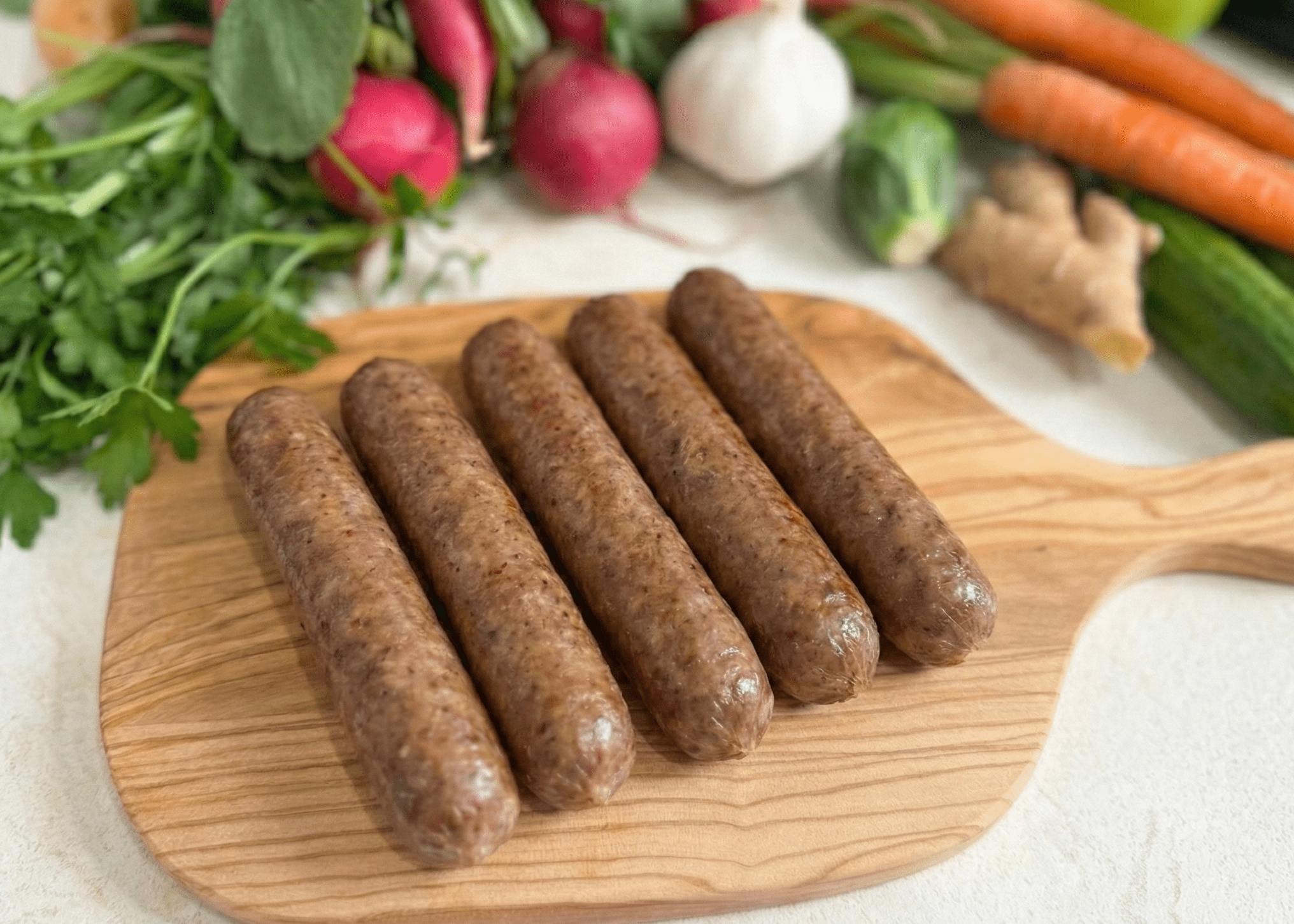 Lamb Bratwurst on a board