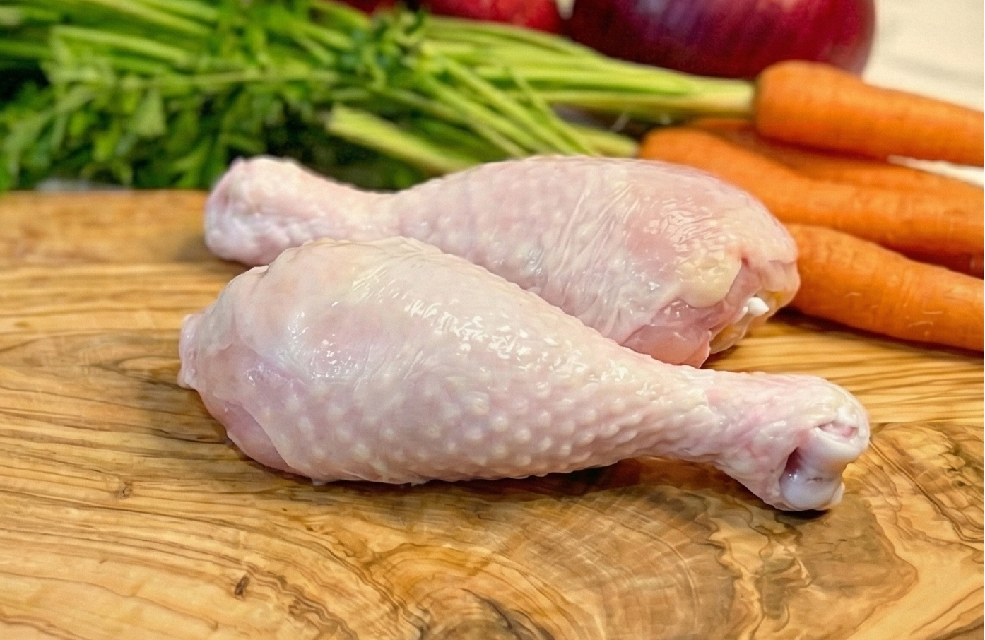 Omega-3 Chicken Drumsticks on a wooden board