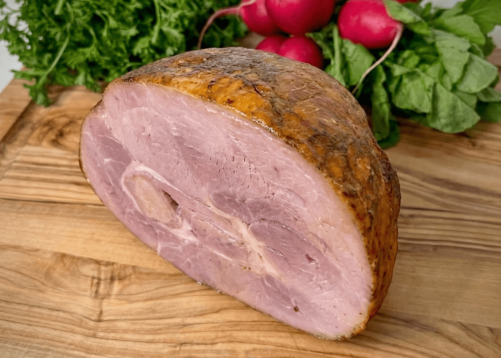 Omega-3 Smoked Pork Ham Shank Roast on a board