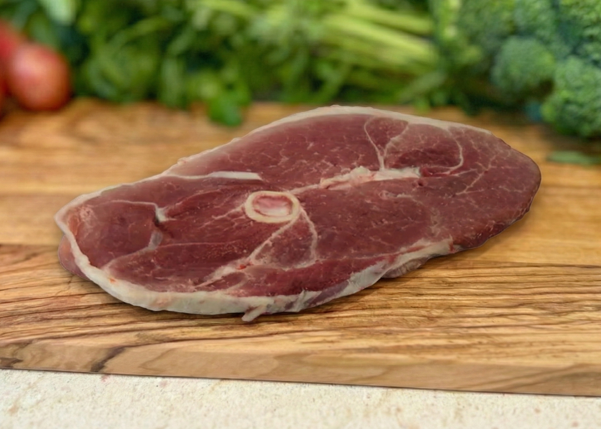 Pork Steaks on a wood board